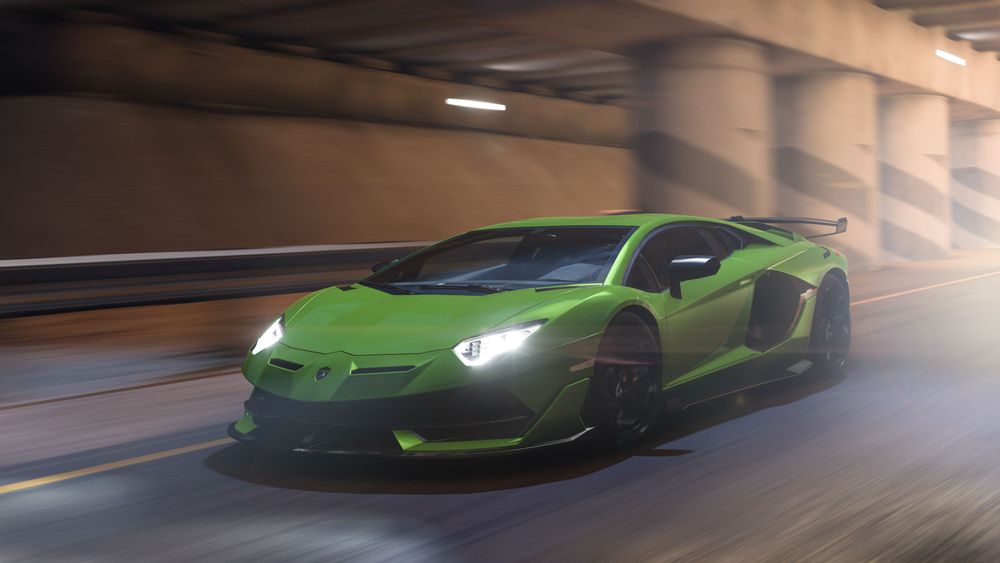 Lamborghini Aventador SVJ speeding through a tunnel road.