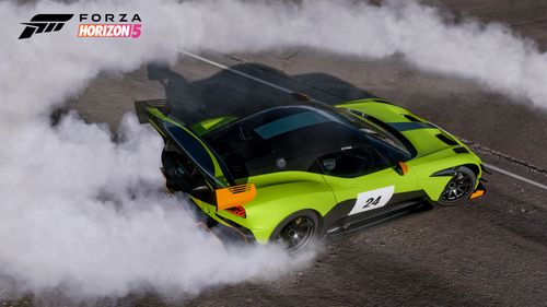 Sports car burning out with a huge cloud of smoke coming off the tires.