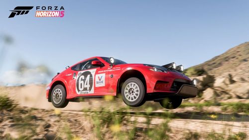 Forsberg Racing Nissan 370z rally car on a dirt road.