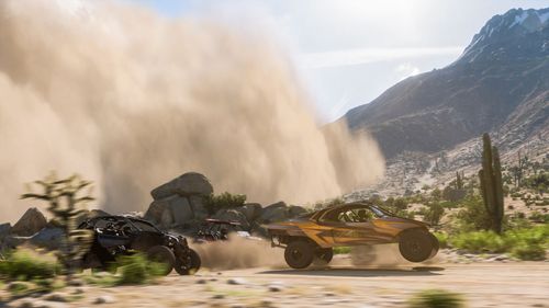 Offroad buggies race away from a sandstorm in FH5.